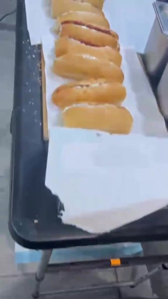 A row of fresh buns lined up and ready at the stand